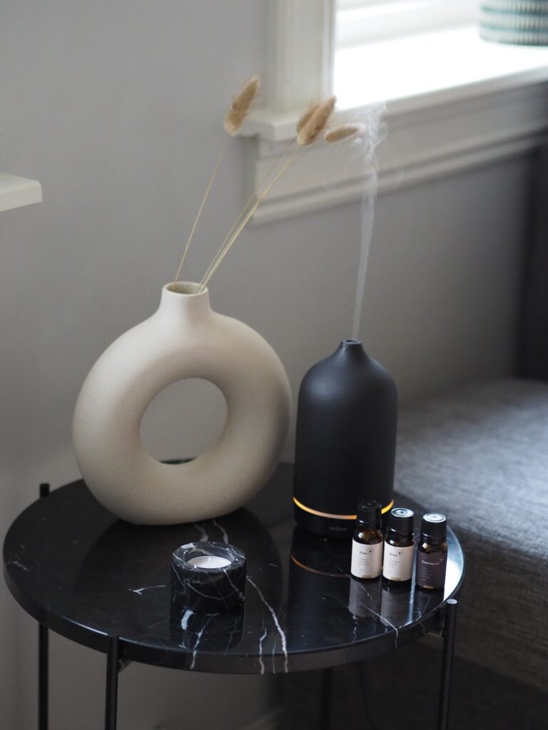 Essential Oils in a black oil diffuser in a home